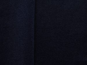 Navy brushed wool coating fabric, flat lay showing dense weave and soft surface texture