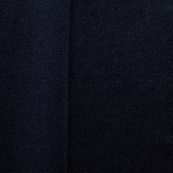 Navy brushed wool coating fabric, flat lay showing dense weave and soft surface texture
