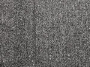 Grey speck hemp cotton blend woven fabric, flat lay showing surface texture and tonal fibre mix