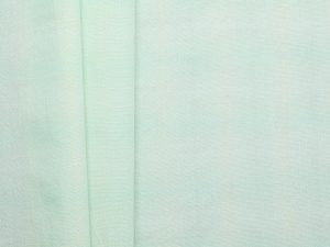 Hazey Check textured cotton fabric in mint and off-white, flat lay showing full width and check pattern