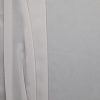 Grey poly chiffon fabric, flat lay showing soft drape and sheer quality