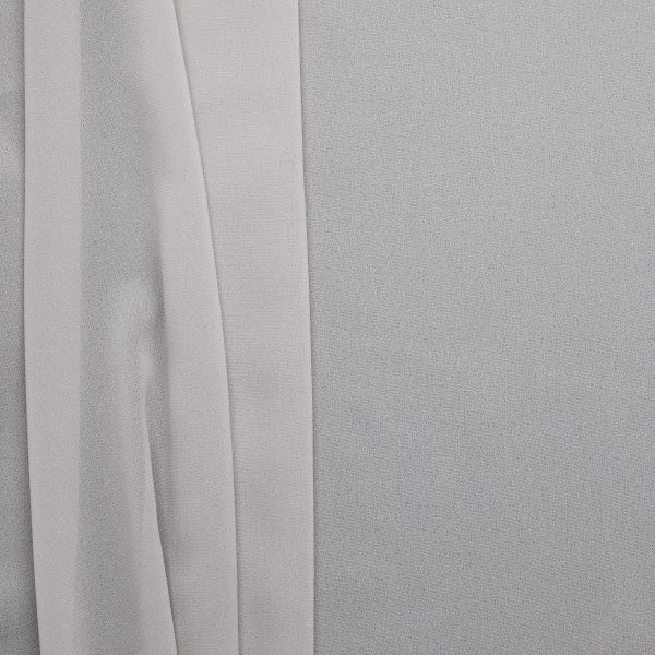 Grey poly chiffon fabric, flat lay showing soft drape and sheer quality